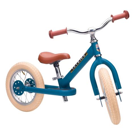 Illustration du Trybike en mode tricycle avec un enfant de bas âge