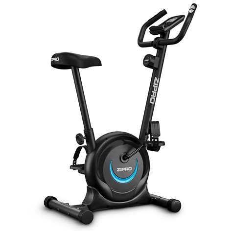 Schéma comparatif entre un vélo d'appartement traditionnel et un vélo d'appartement pliable, mettant en évidence la compacité du modèle pliable.