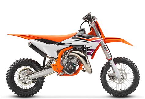 Illustration d'une KTM SX 65 équipée du kit plastique orange fluo, mettant en avant sa couleur vive et son design sportif.