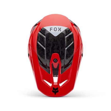 Schéma technique du casque Fox V3 RS Infinite, mettant en avant la coque carbone et le système Mips
