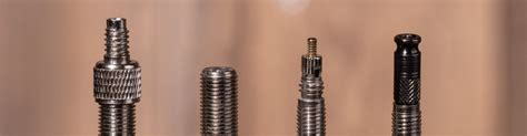 Illustration comparative des trois principaux types de valves de vélo : Sclaverand, Schrader et Dunlop.