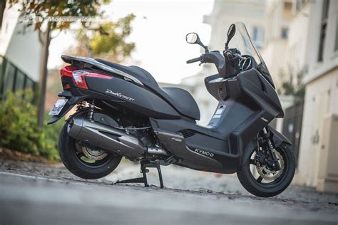 schéma du tableau de bord du KYMCO Dink Street 300 avec indication des différents témoins et indicateurs