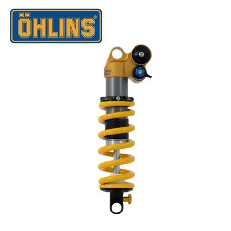 Schéma technique d'un amortisseur VTT Öhlins avec annotations sur les réglages externes (rebond, compression basse et haute vitesse).