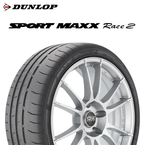 Schéma technique du pneu Dunlop Sport Maxx Race montrant le dessin asymétrique et le bloc d'épaule.